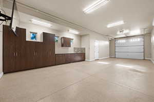 Garage featuring baseboards