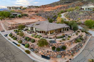 Aerial view of property and surrounding area featuring mountains