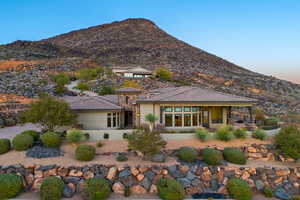 Rear view of house featuring a patio, a mountain view, and stucco siding