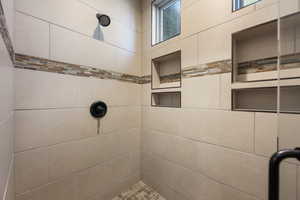 Full bathroom with a tile shower