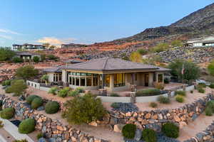 Back of property with a fenced backyard, a patio, a tiled roof, stucco siding, and a mountain view