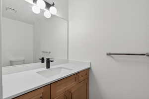 Half bath with vanity and toilet. Main level
