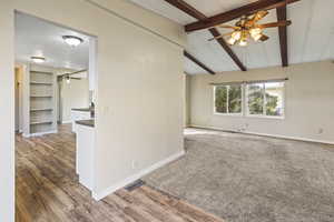 Empty room featuring a ceiling fan and light wood finished floors