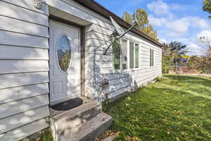 Property entrance with a lawn