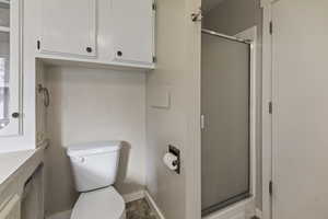 Bathroom with a stall shower and vanity