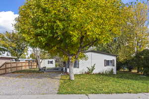View of front of property with a wooden deck