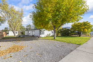 View of front of home featuring a shed