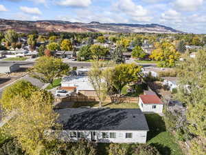 Aerial perspective of suburban area featuring a mountainous background