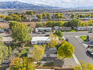 Aerial perspective of suburban area with a mountainous background