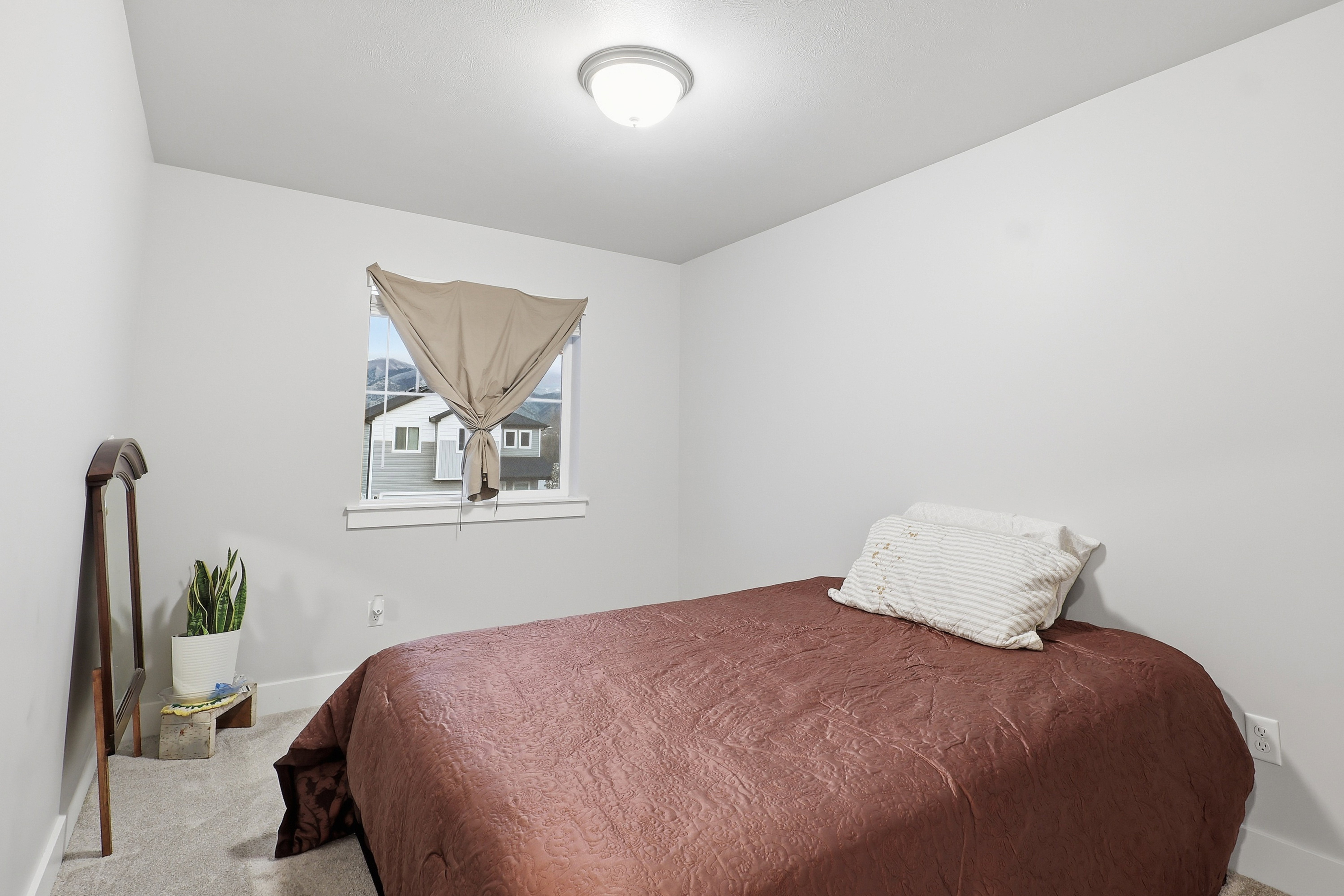 Carpeted bedroom featuring baseboards