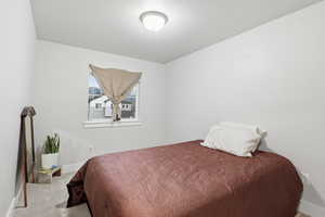 Carpeted bedroom featuring baseboards