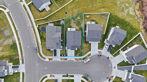 Aerial view of residential area with property boundaries highlighted