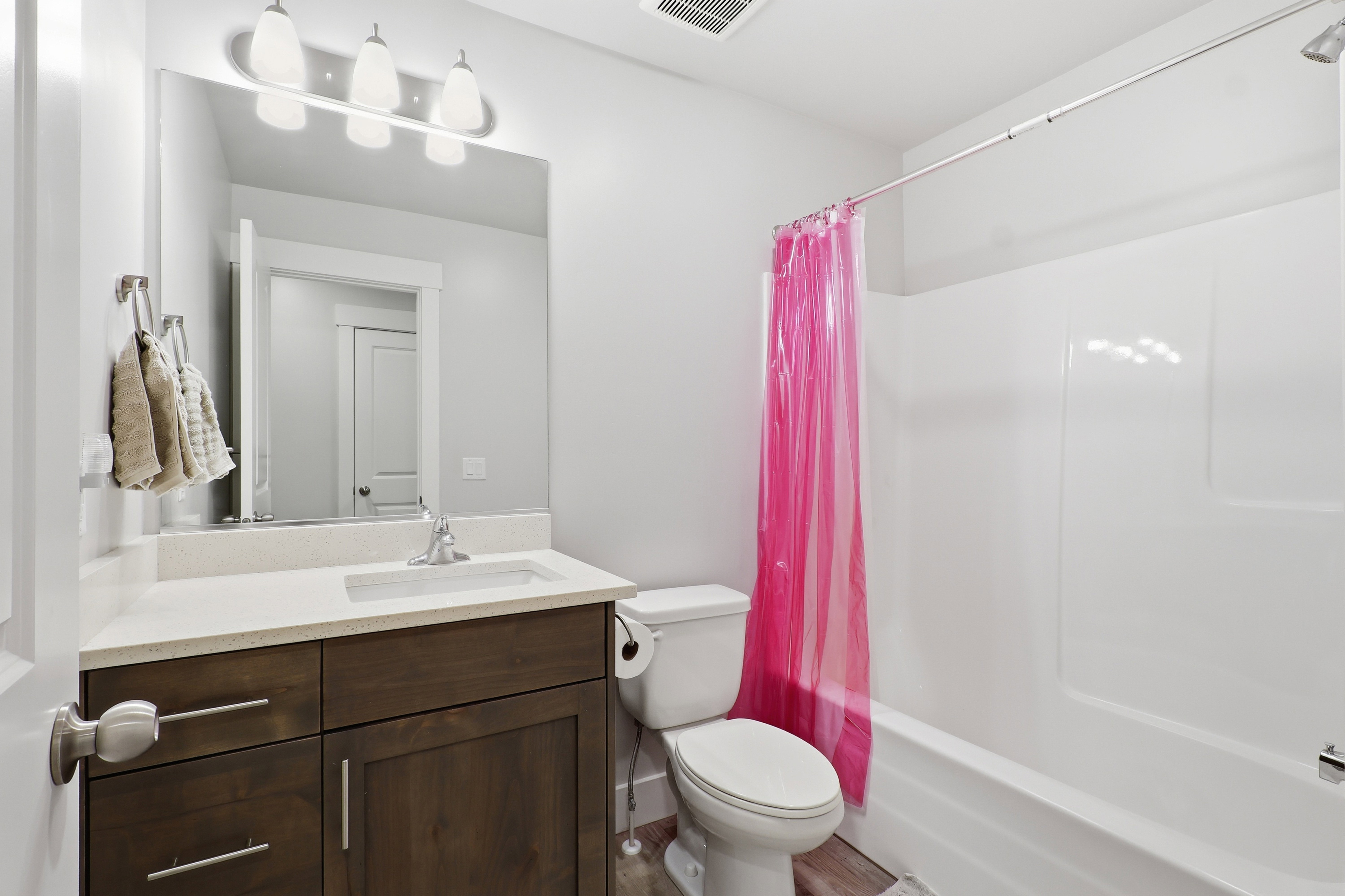 Bathroom featuring vanity and shower / bath combo