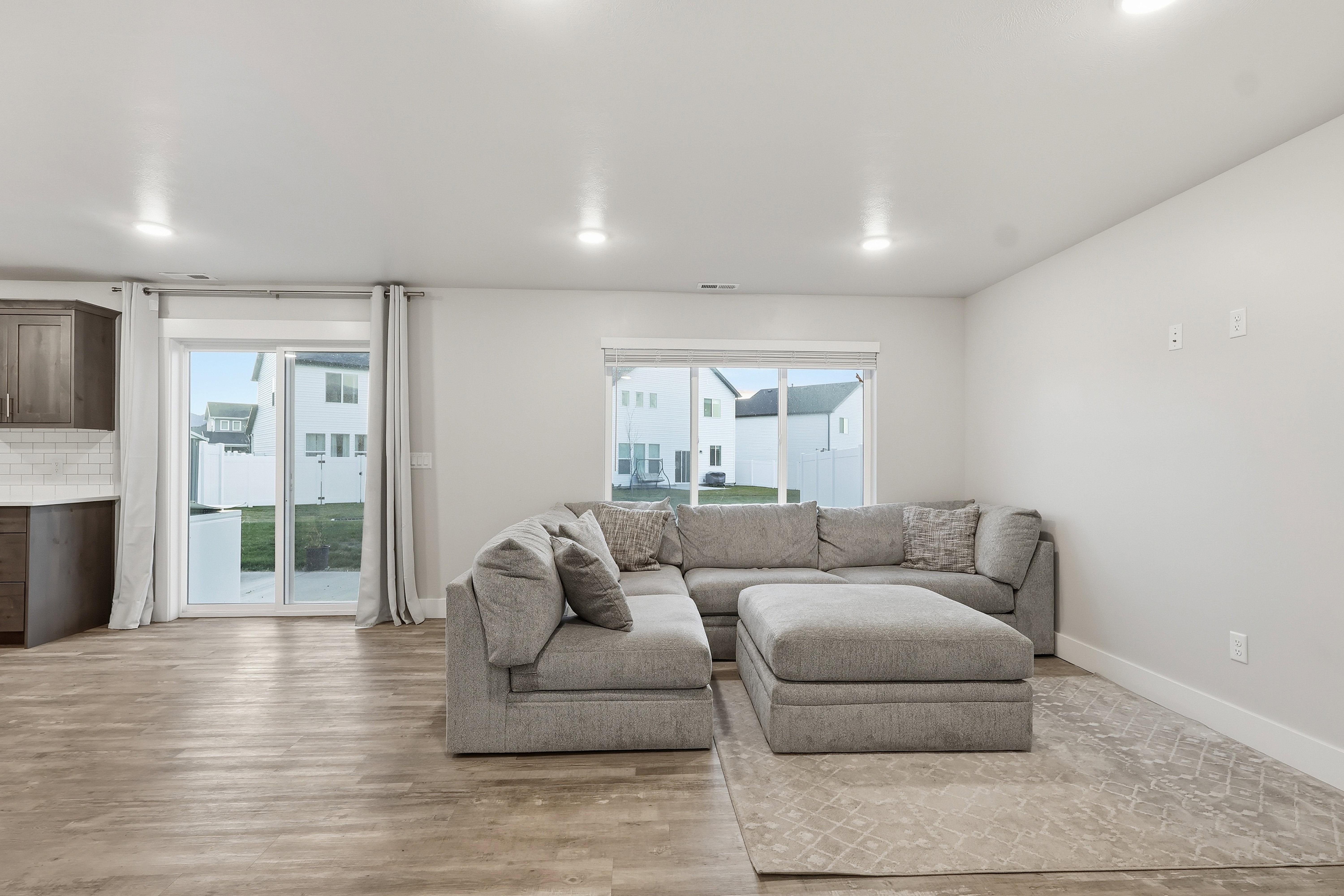 Living room with light wood-style floors and baseboards