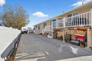 View of parking / parking lot - concrete driveway