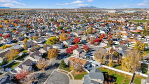 Aerial perspective of suburban area with a mountain backdrop