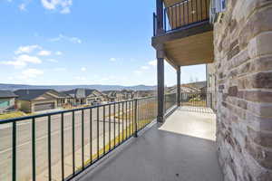 Balcony with a residential view and a mountain view