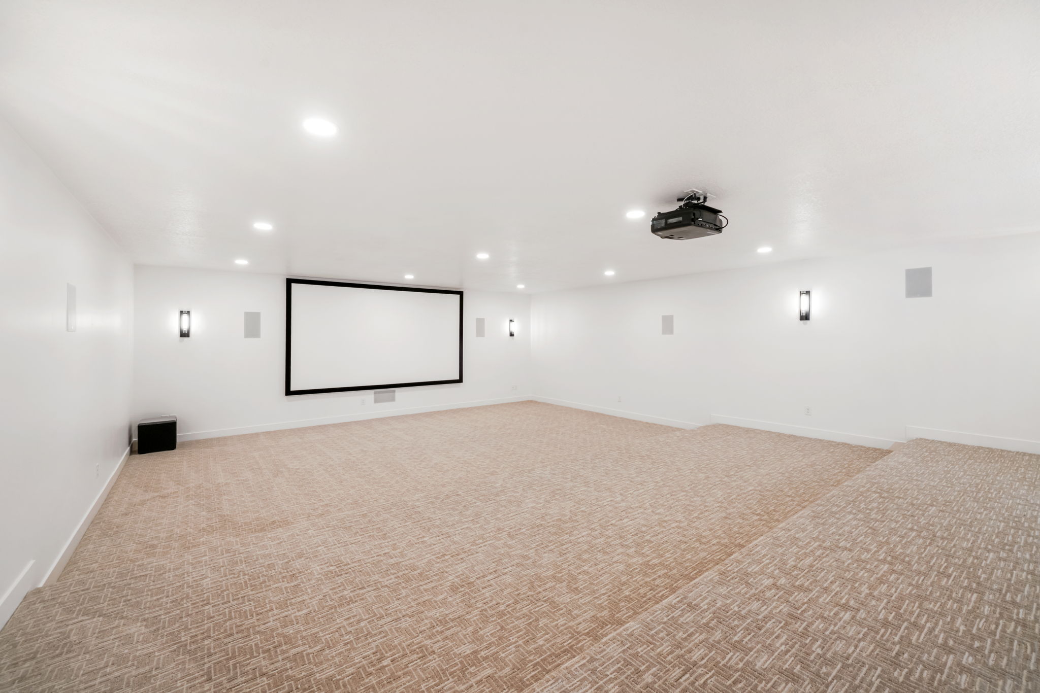 Cinema room featuring light colored carpet and recessed lighting