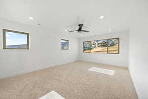 Carpeted empty room with recessed lighting and a ceiling fan