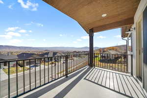 Balcony featuring a residential view and a mountain view