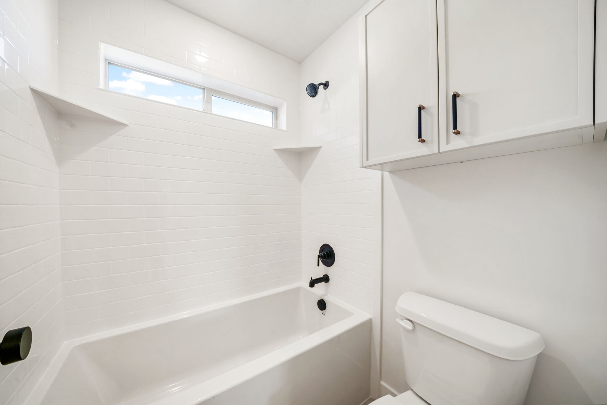 Full bath featuring shower / bath combination and toilet