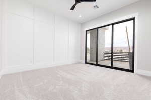 Spare room with carpet, ceiling fan, and recessed lighting