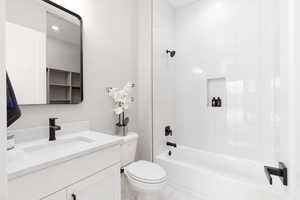 Full bath with vanity, shower / bath combination, and tile patterned flooring