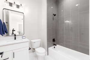 Bathroom with shower / bath combination and vanity