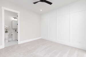 Unfurnished bedroom featuring recessed lighting, light colored carpet, and a ceiling fan