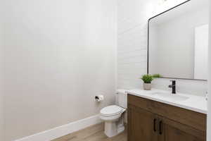 Bathroom featuring vanity and light wood finished floors