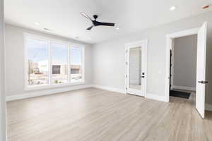 Spare room featuring recessed lighting, light wood finished floors, and a ceiling fan