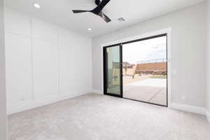 Unfurnished room featuring carpet, ceiling fan, and recessed lighting