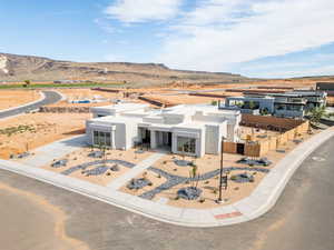 View of front facade featuring stucco siding and a mountain view