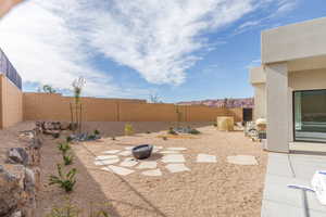 Fenced backyard with a patio and a mountain view