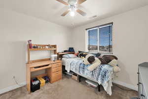 Bedroom with light carpet and ceiling fan
