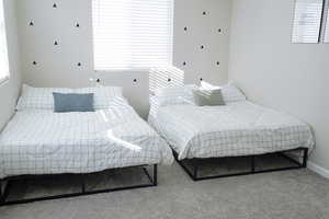 Bedroom with carpet and baseboards