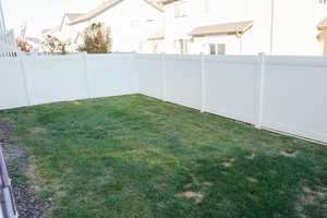 View of fenced backyard