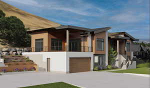 Contemporary home with concrete driveway, stairway, a balcony, and a garage