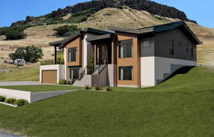 View of front of house featuring a front yard, a mountain view, stucco siding, a garage, and stairway