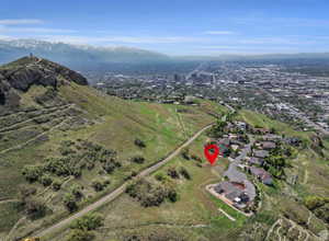 View of property location featuring nearby suburban area and a mountain backdrop