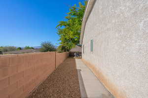 View of side of home featuring stucco siding