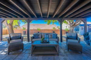 Fenced backyard with a patio and grilling area