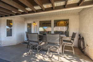 View of patio with outdoor dining space