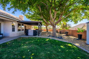 Fenced backyard featuring a patio area