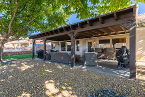 Back of house with a patio