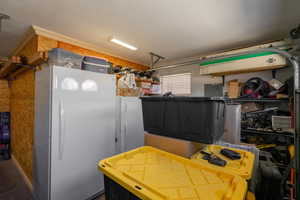 Kitchen with freestanding refrigerator and electric panel