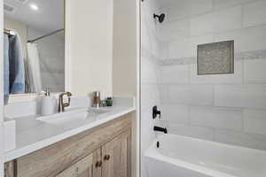 Full bathroom featuring vanity and shower / bath combination with curtain