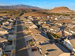 Aerial perspective of suburban area with a mountainous background