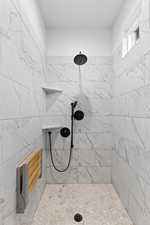 Bathroom featuring tiled shower