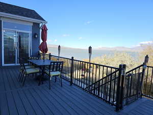 Trek deck with Utah Lake and mountain views, outdoor dining area